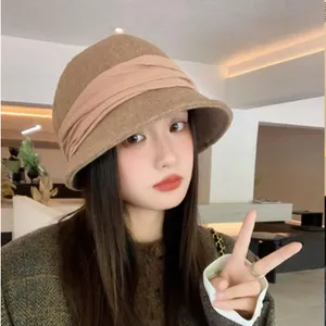 Elegant brown vintage cloche hat with pleated band for women, stylish winter bucket hat