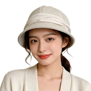 Elegant women's beige pleated bucket hat in French vintage style for winter