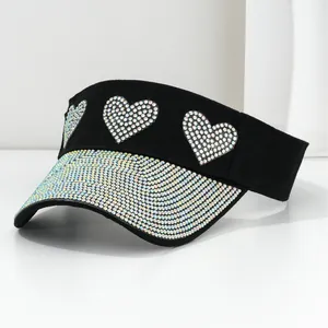 Black visor hat with sparkling iridescent rhinestones and heart patterns for sun protection