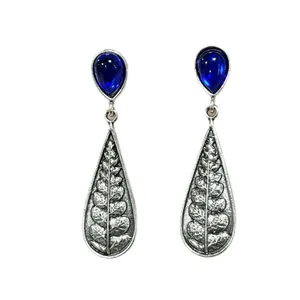 Vintage silver drop earrings featuring deep blue teardrop gems and intricate fern leaf patterns