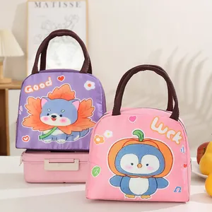 Close-up of cute cartoon insulated lunch bags with cat and penguin designs.