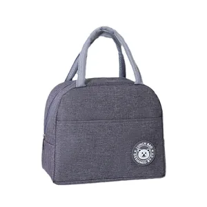 Borsa pranzo bento grigia isolata in tessuto impermeabile con logo orsetto carino
