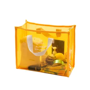 Bright yellow transparent PVC waterproof beach tote for swimming and travel storage.