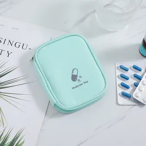 Compact mint green portable medicine bag with secure zipper and pill icon detail.
