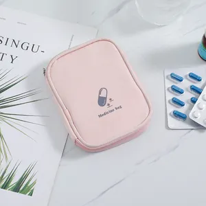 Detail view of a pink portable medicine bag designed for travel first aid medicine