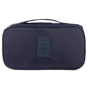 Portable navy blue travel storage bag for underwear and toiletries with top handle