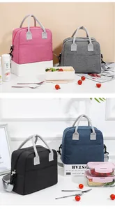 Multiple colors of large insulated lunch bags displayed with food containers and lifestyle props.