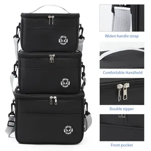 Black insulated lunch bag set with adjustable shoulder straps and side pocket detail