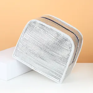 Portable silver insulated lunch bag for commuting and school with thermal foil lining