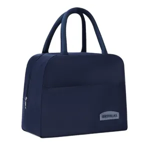 Navy blue insulated lunch bag with front pocket and double braided handles for work