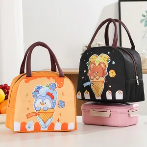 Pair of cute cartoon insulated lunch bags with penguin and bear ice cream designs.
