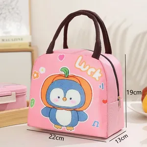 Detail view of pink insulated lunch bag featuring cartoon penguin and size markings