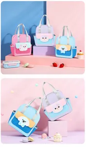 Various cute cartoon lunch bags with animal designs and soft pastel colors in a group display