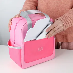 Portable cute pink insulated lunch bag for students and office workers with front pocket.