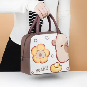 Handheld view of a cartoon insulated lunch bag featuring a cute Capybara character design