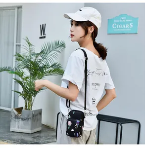 Model showing the compact size and heart zipper detail of the printed phone pouch