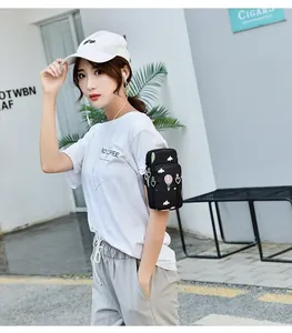 Detail showing a stylish printed arm bag for mobile phones in outdoor lifestyle use