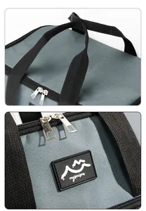 Dettaglio della cerniera e del logo su una borsa termica blu per picnic all'aperto.