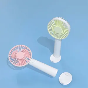 Portable USB rechargeable mini handheld fan for desktop use in pink and green colors