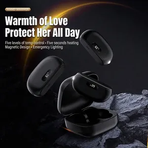 Portable magnetic hand warmer with digital display and charging case on dark stone base