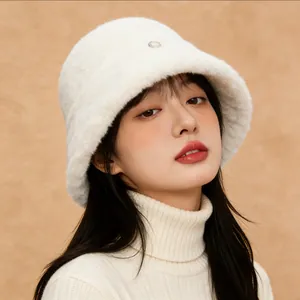 Close-up of a cozy white fuzzy bucket hat for women in autumn and winter styles