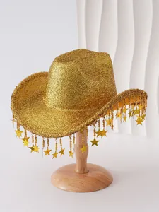 Detailed view of a golden glitter cowboy hat with star tassels on a professional stand.