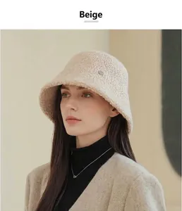 Close-up of a beige textured wool bucket hat worn by an Asian model for winter warmth