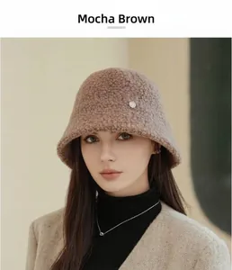 Close-up view of a warm mocha teddy wool bucket hat worn by a model in soft lighting