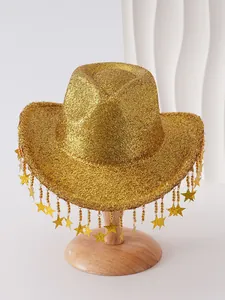 Detail view of shimmering gold cowboy hat featuring dangling gold star tassels