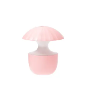 Petit humidificateur USB silencieux en forme de champignon rose sur fond blanc pour bureau