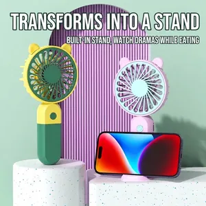 Cartoon portable USB rechargeable handheld fan with an integrated phone stand base