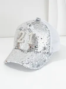 Close-up of silver sequined baseball cap with pearl encrusted number 21 and white mesh
