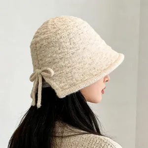 Korean style cream knitted bucket hat with side bow detail for women