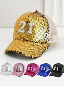 Detail of sequin baseball caps featuring pearl number 21 embellishment in various colors