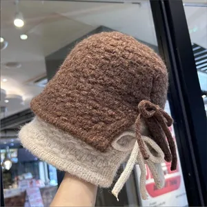 Women's cozy winter warm knitted bucket hats featuring a stylish handmade bow detail