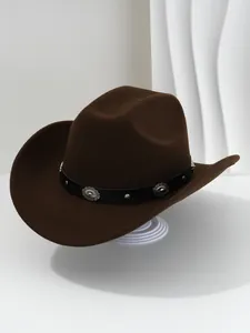 Detailed close-up view of a brown western cowboy hat with studded black faux leather band.