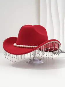 Detailed view of red vintage felt hat featuring a pearl band and sparkling rhinestone tassels