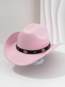 Close-up view of a pink felt cowboy hat featuring a floral studded black leather band