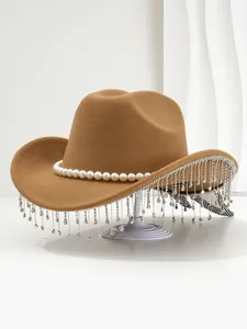 Detailed view of camel felt cowboy hat with pearls and rhinestone fringe decoration