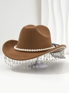 Detailed view of brown felt cowboy hat with pearl trim and sparkling rhinestone fringe