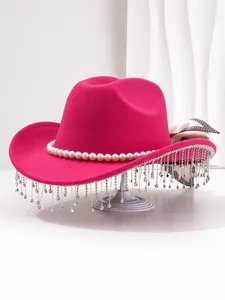 Close-up of pink western hat with elegant pearls and sparkling rhinestone tassel trim