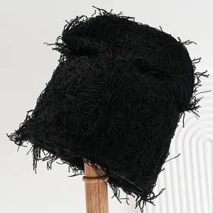 Stylish unisex black distressed shaggy knitted bucket hat for winter travel and fashion