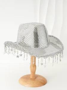 Close-up detail of a sparkly silver cowboy hat featuring mirror sequins and star tassels