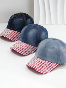 Detailed view of three denim baseball caps featuring colorful rhinestone-encrusted brims.