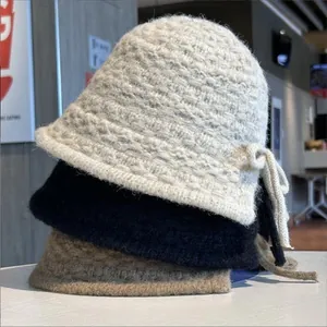 Elegant handmade knitted bucket hats with bow detail for women in cold winter