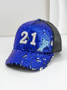 Close-up of blue sequin baseball cap featuring pearl and rhinestone number 21 detail