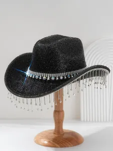 Macro view of black sparkling cowboy hat featuring shimmering rhinestone fringe and gem band