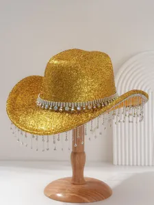 Detail view of gold glitter cowboy hat with rhinestone tassels for music festivals