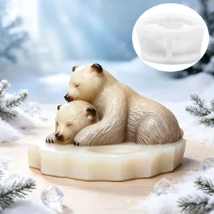 Detail of polar bear cuddling candle holder silicone mold with finished resin model