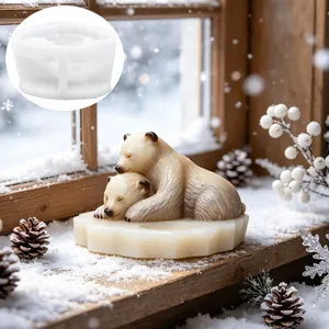 Close-up view of DIY polar bear silicone mold showing finished cuddling bears candle design